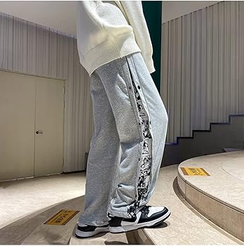 Light gray wide-leg track pants with side bandana patch and tapered drawstring hem