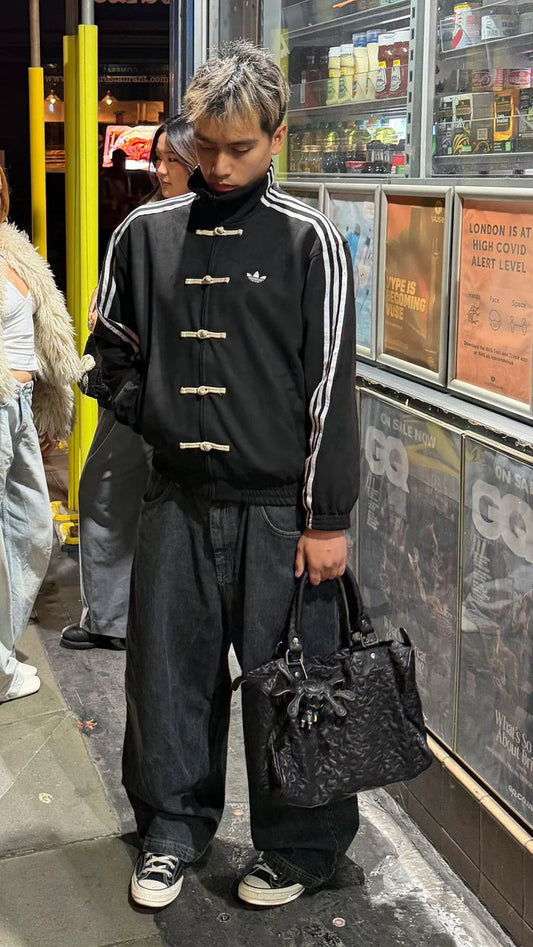 fashion jacket featuring striped button detailing and fusion design