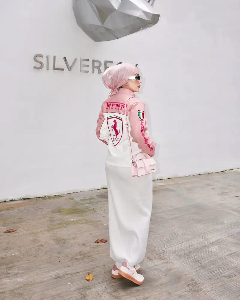 Pink and white racing jacket showing back Ferrari logo and sleeve crest patch