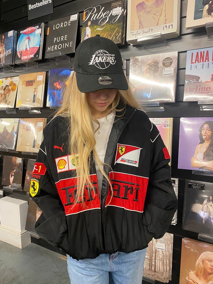 Black bomber jacket with red panel graphic and Ferrari F1 patch, zip front