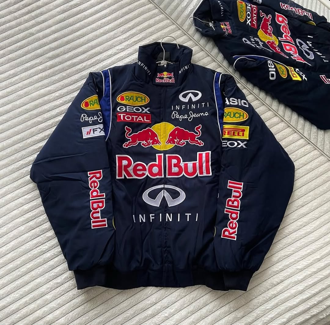 Vintage racing jacket laid flat with Red Bull front graphic and sleeve patches