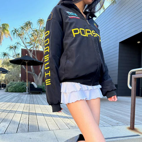 Black racing jacket with yellow Porsche PORSCH chest logo and zip front
