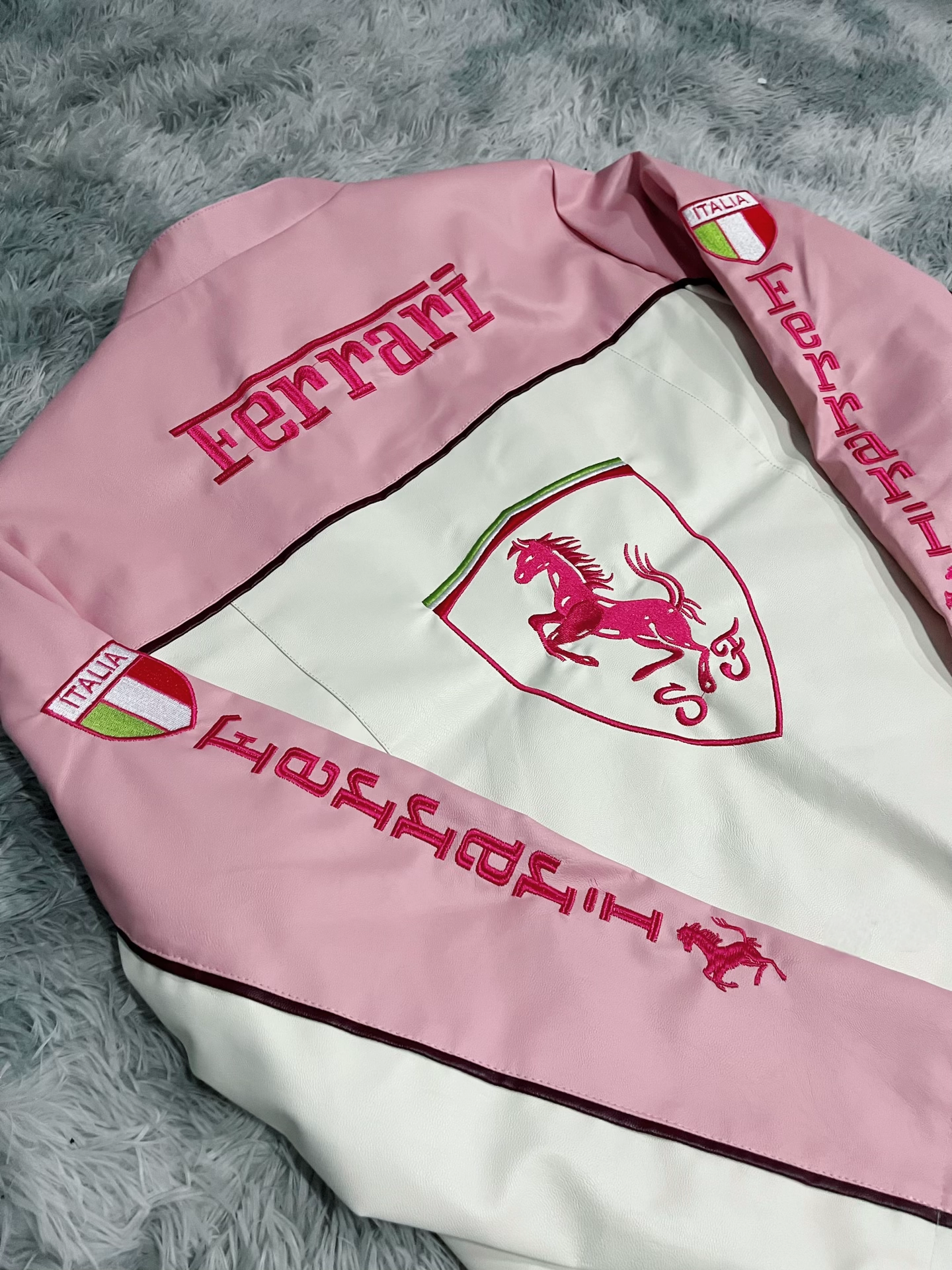 Back View of Pink Ferrari Leather Jacket Featuring Ferrari Branding