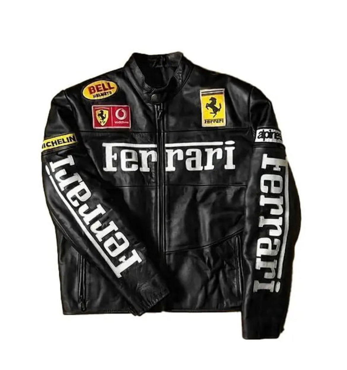 Black moto jacket with "Ferrari" chest text, Ferrari shield patches, and vertical Ferrari sleeve lettering