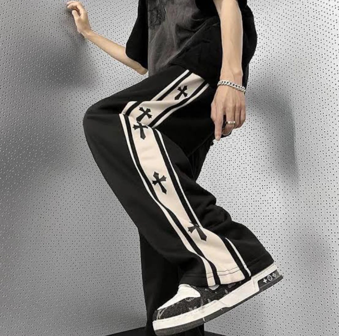 Baggy track pants in black with white cross stripe and wide legs