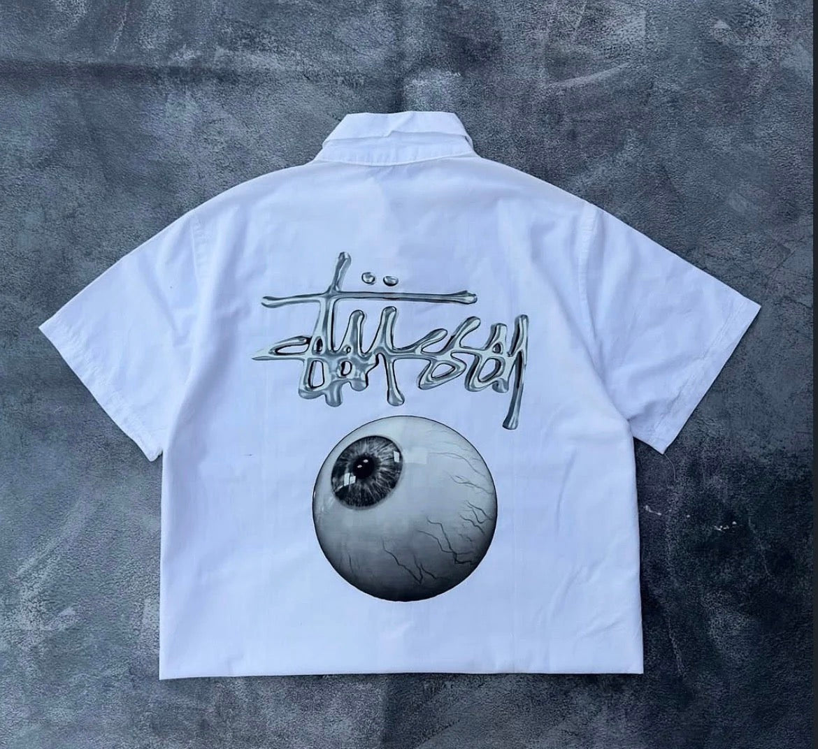 White oversized shirt with bold eyeball graphic print unisex