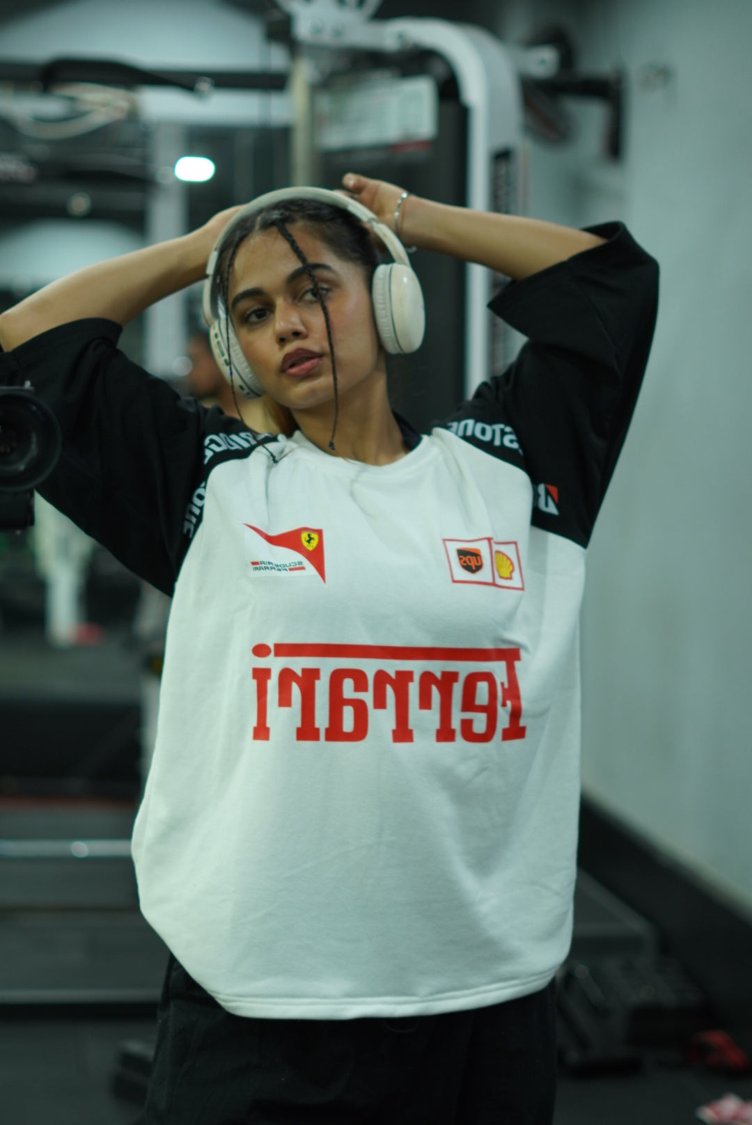White racing T-shirt with bold red front graphic and Ferrari shield patches