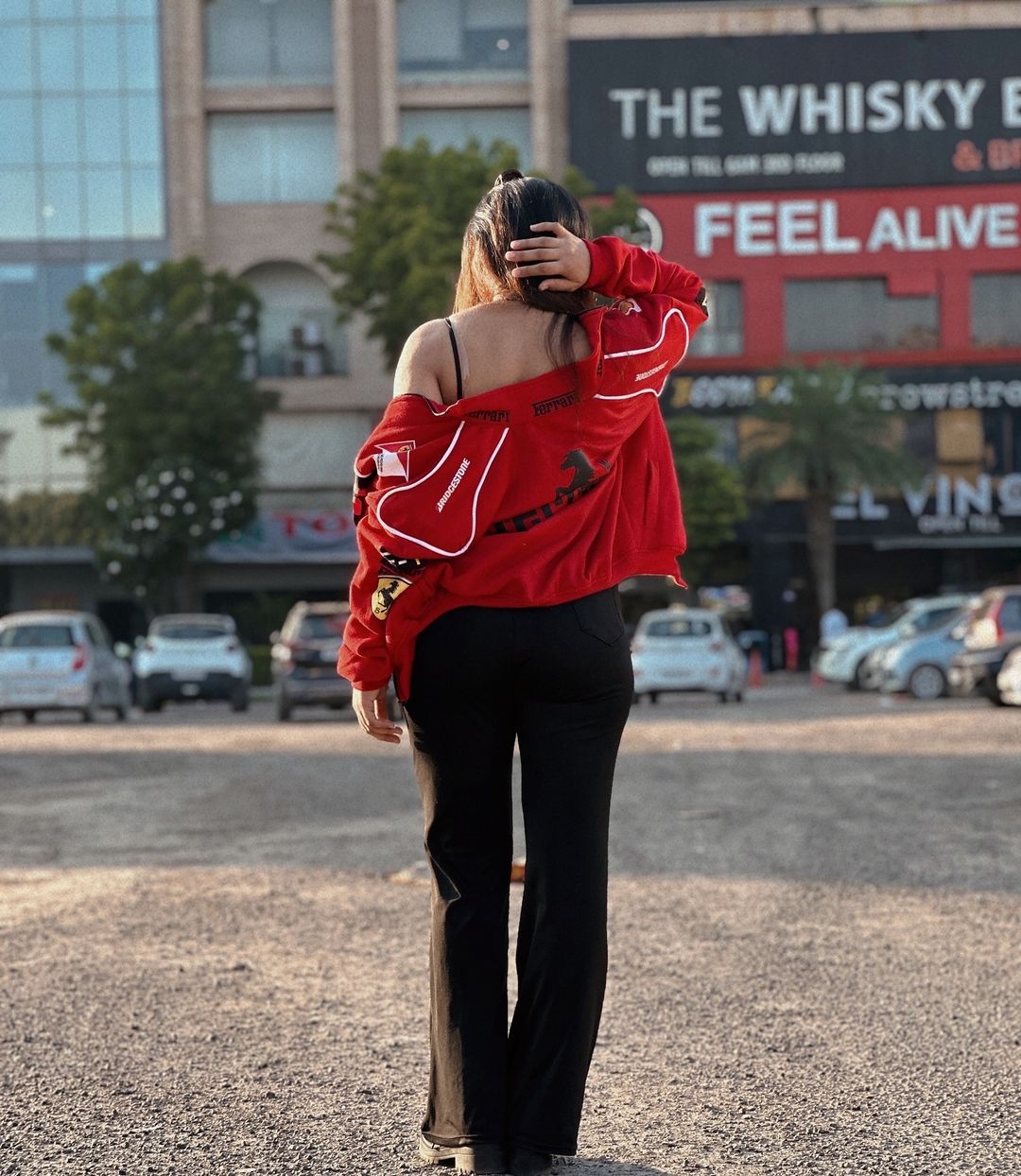 Red racing zip-up jacket with white trim and bold back graphic