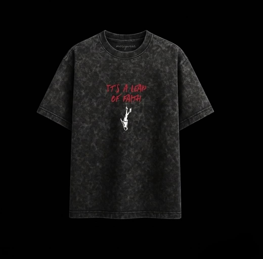 Acid-wash dark gray T-shirt with red chest text and small graphic