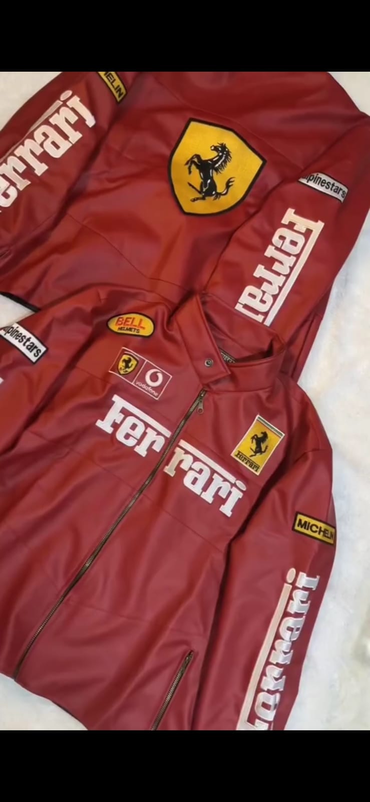 Red leather racing jacket with Ferrari emblem chest patch and vertical arm lettering