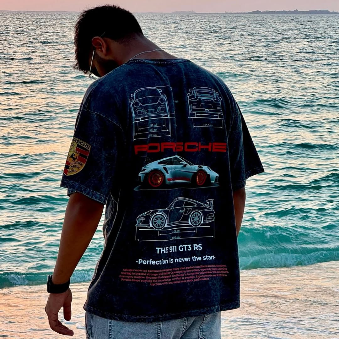 Navy acid-wash T-shirt on person with back print of Porsche and car sketches
