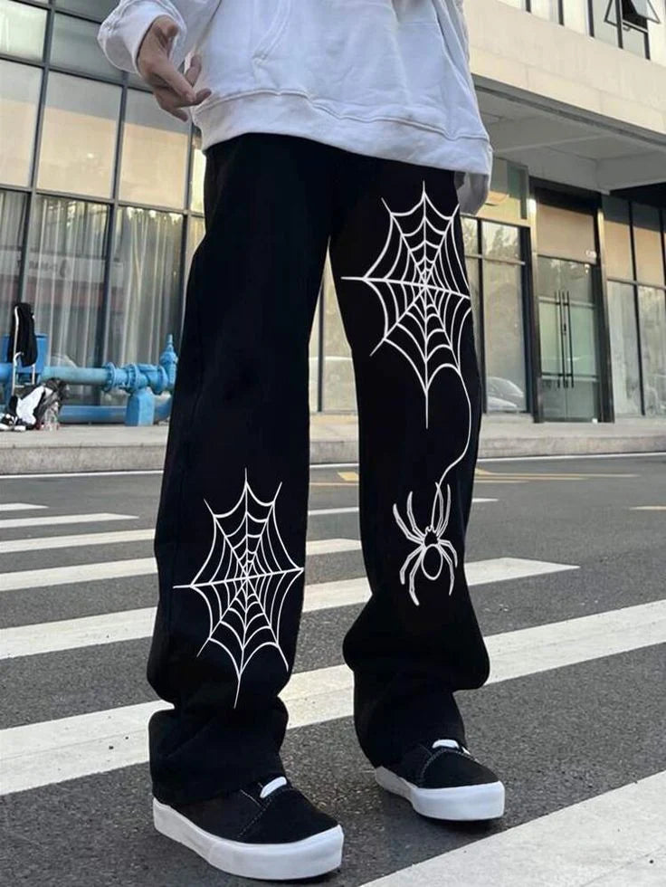 Black baggy straight-fit track pants with spider web and spider graphic on legs
