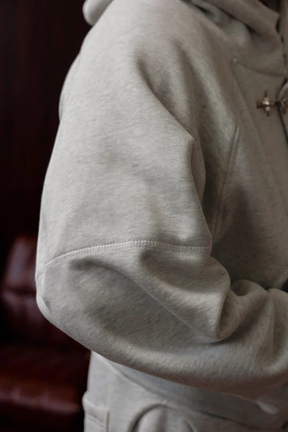 Grey metal fireman clasp hoodie front view by Mercywear