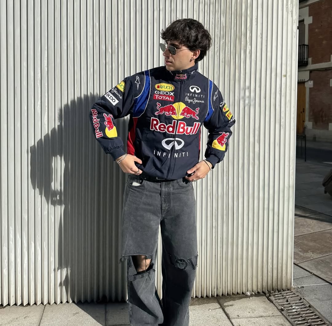 Vintage embroidered racing jacket on model with Red Bull back logo and jeans