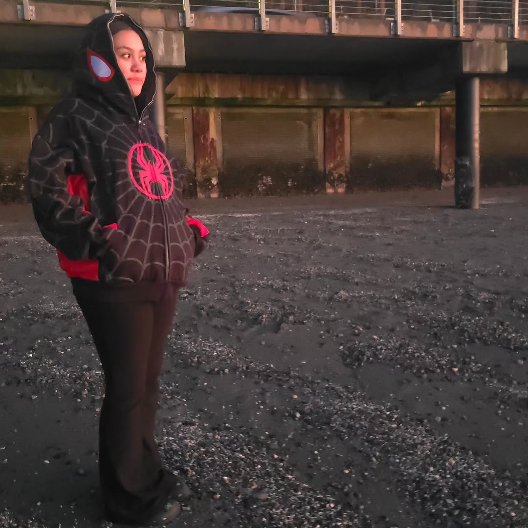 Black spider web zip-up hoodie with red accents and large chest spider graphic.